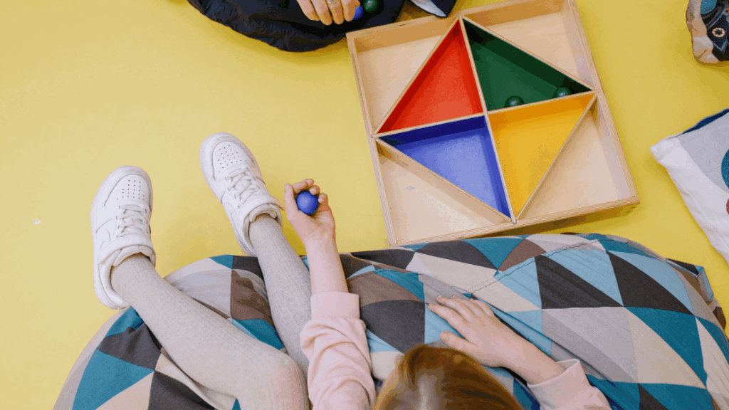 Child playing with colorful toys